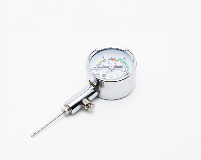Silver metal barometer laying flat