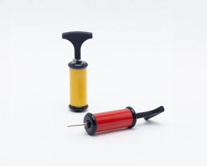 Upright black and yellow ball pump and red and black ball pump