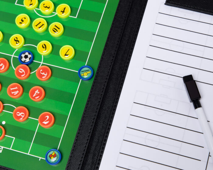 Close-up of a soccer and football training planner